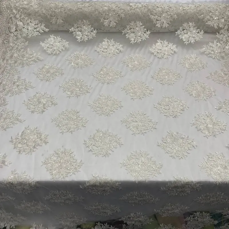 Corded flowers white lace fabric